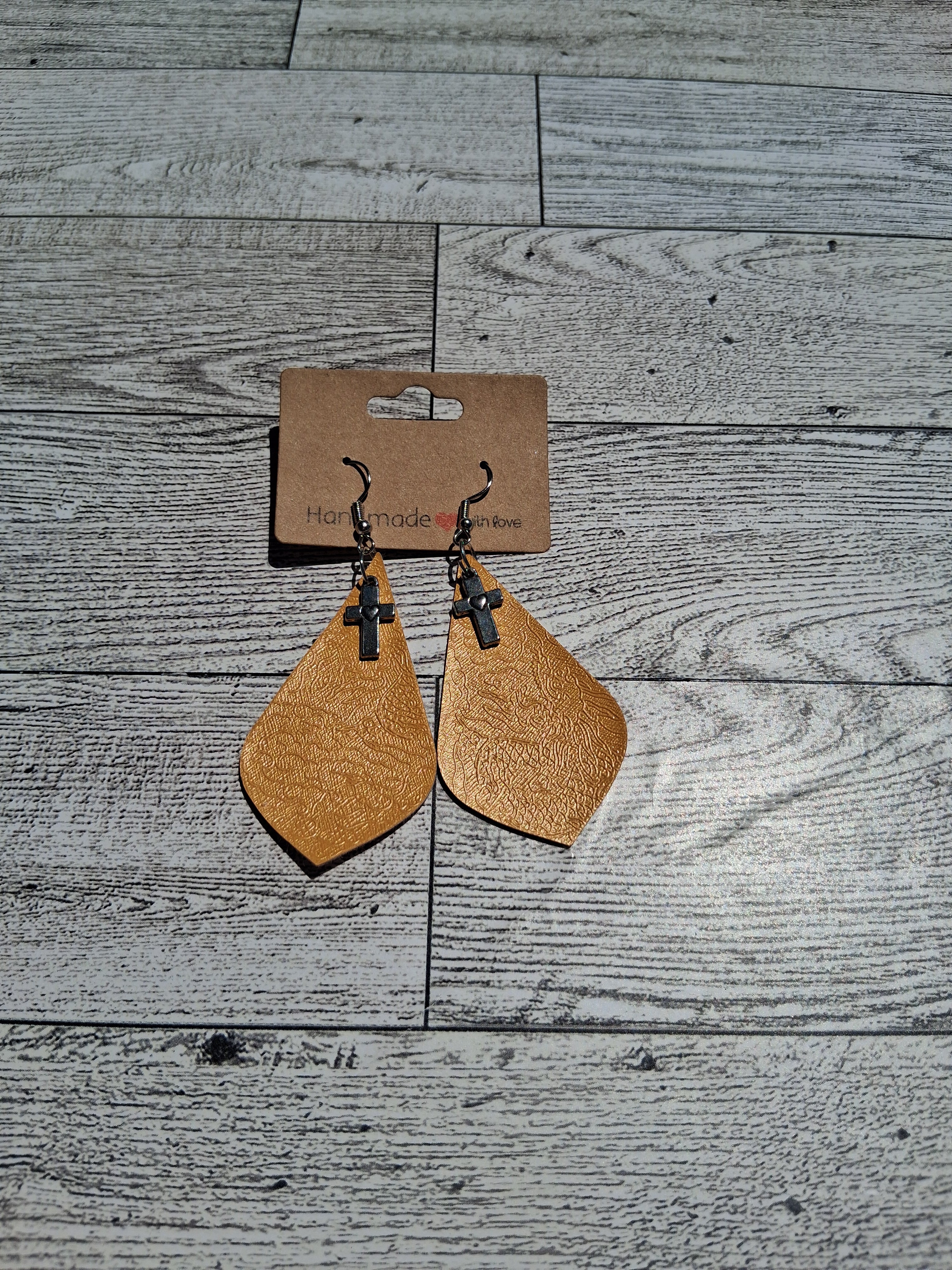 Cross charm earring